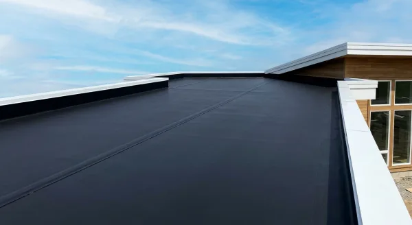 Installed black Versico VersiGard EPDM membrane detail on a residential flat roof